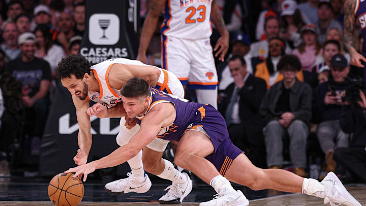 Phoenix Suns guard Grayson Allen battles New York Knicks guard Landry Shamet.