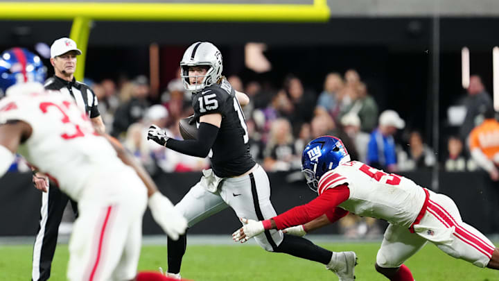Dec 28, 2025; Paradise, Nevada, USA; Las Vegas Raiders quarterback Kenny Pickett (15) looks for an open receiver in the fourth quarter against the New York Giants at Allegiant Stadium. Mandatory Credit: Stephen R. Sylvanie-Imagn Images