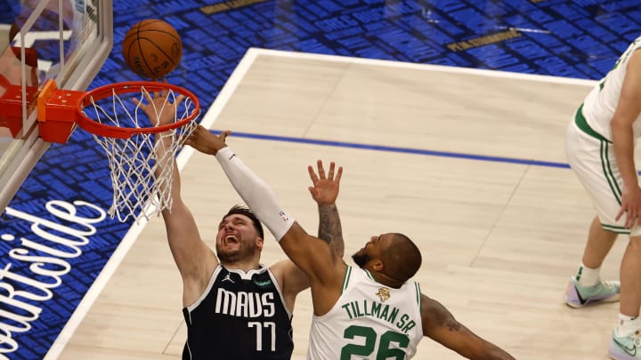 Jun 12, 2024; Dallas, Texas, USA; Dallas Mavericks guard Luka Doncic (77) shoots against Boston Celtics forward Xavier Tillman (26) during the second quarter in game three of the 2024 NBA Finals at American Airlines Center. Mandatory Credit: Peter Casey-USA TODAY Sports Jun 12, 2024; Dallas, Texas, USA; Dallas Mavericks guard Luka Doncic (77) shoots against Boston Celtics forward Xavier Tillman (26) during the second quarter in game three of the 2024 NBA Finals at American Airlines Center. Mandatory Credit: Peter Casey-USA TODAY Sports