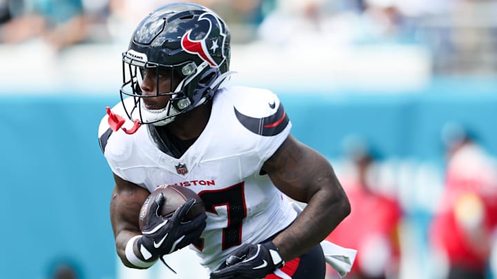 Sep 21, 2025; Jacksonville, Florida, USA; Houston Texans cornerback Myles Bryant (27) runs with the ball during the second quarter against the Jacksonville Jaguars at EverBank Stadium. Mandatory Credit: Morgan Tencza-Imagn Images