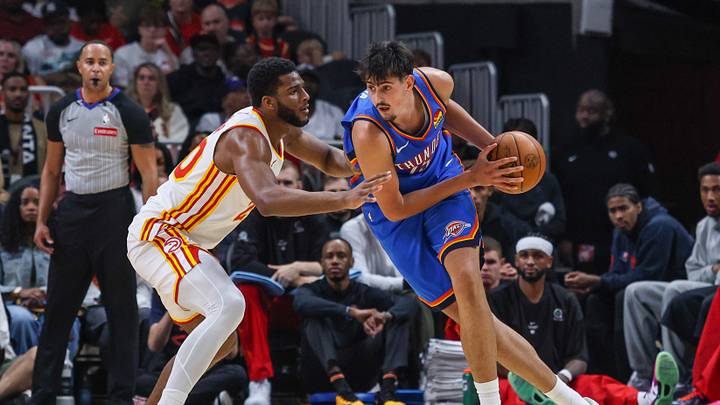 Oct 12, 2026; Atlanta, Georgia, USA;  Oklahoma City Thunder center Aday Mara (15) protects the ball against Atlanta Hawks forward Zuby Ejiofor (20) during the second quarter at State Farm Arena.  Mandatory Credit: Jordan Godfree-Imagn Images