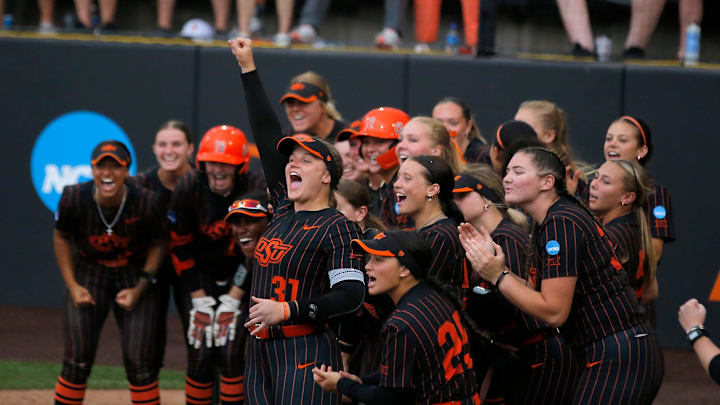 Oklahoma State celebrates the home run of Rosie Davis (26) in the third inning of Game 2 of the NCAA softball tournament Stillwater Super Regional between the Oklahoma State Cowgirls and the Arizona Wildcats in Stillwater, Okla., Saturday, May, 25, 2024.