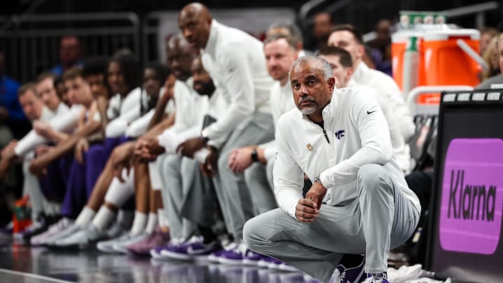 Mar 11, 2025; Kansas City, MO, USA; Kansas State Wildcats coach Jerome Tang watches game play against the Arizona State Sun Devils during the first half at T-Mobile Center. Mandatory Credit: William Purnell-Imagn Images