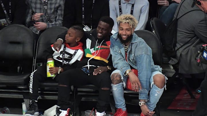 Feb 18, 2018; Los Angeles, CA, USA; American actor Kevin Hart smiles with son Hendrix Hart and New York Giants player Odell Beckham Jr. during the 2018 NBA All Star game between Team LeBron and Team Stephen at Staples Center. Mandatory Credit: Kirby Lee-Imagn Images