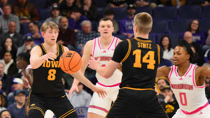 Feb 4, 2026; Seattle, Washington, USA; Iowa Hawkeyes forward Cooper Koch (8) passes the ball to guard Bennett Stirtz (14) during the first half against the Washington Huskies at Alaska Airlines Arena at Hec Edmundson Pavilion. Mandatory Credit: Steven Bisig-Imagn Images Feb 4, 2026; Seattle, Washington, USA; Iowa Hawkeyes forward Cooper Koch (8) passes the ball to guard Bennett Stirtz (14) during the first half against the Washington Huskies at Alaska Airlines Arena at Hec Edmundson Pavilion. Mandatory Credit: Steven Bisig-Imagn Images