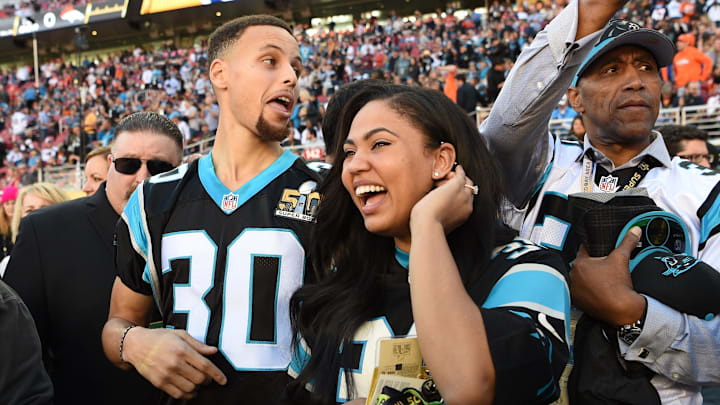 Feb 7, 2016: Golden State Warriors guard Stephen Curry and his wife Ayesha Curry stand on the sidelines for the Carolina Panthers game.