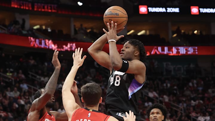 Feb 23, 2026; Houston, Texas, USA; Utah Jazz guard Isaiah Collier (8) shoots against Houston Rockets forward Tari Eason (17) and guard Reed Sheppard (15) in the second quarter at Toyota Center. Mandatory Credit: Thomas Shea-Imagn Images Feb 23, 2026; Houston, Texas, USA; Utah Jazz guard Isaiah Collier (8) shoots against Houston Rockets forward Tari Eason (17) and guard Reed Sheppard (15) in the second quarter at Toyota Center. Mandatory Credit: Thomas Shea-Imagn Images