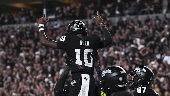 Texas A&M Aggies quarterback Marcel Reed (10) is hoisted in celebration after scoring a touchdown in the fourth quarter against the Mississippi State Bulldogs at Kyle Field. 