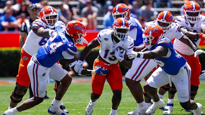 Florida Gators running back Jadan Baugh (13) runs up field in the first half during the Orange and Blue game at Ben Hill Griffin Stadium in Gainesville, FL on Saturday, April 13, 2024 [Doug Engle/Gainesville Sun]2024