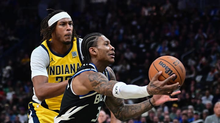 Apr 27, 2025; Milwaukee, Wisconsin, USA; Milwaukee Bucks guard Kevin Porter (3) drives for the basket against Indiana Pacers center Myles Turner (33) in the fourth quarter during game four of first round for the 2024 NBA Playoffs at Fiserv Forum. Mandatory Credit: Benny Sieu-Imagn Images