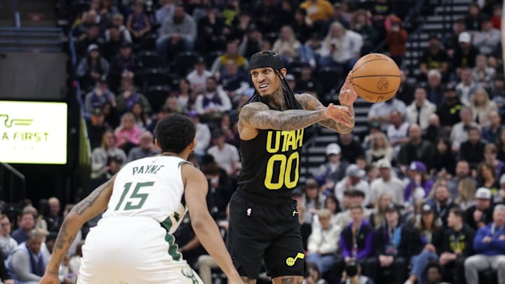 Feb 4, 2024; Salt Lake City, Utah, USA;  Utah Jazz guard Jordan Clarkson (00) passes the ball away from Milwaukee Bucks guard Cameron Payne (15) during the second quarter at Delta Center. Mandatory Credit: Chris Nicoll-Imagn Images