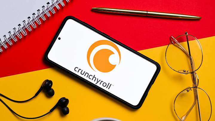 In this photo illustration a Crunchyroll logo seen displayed...