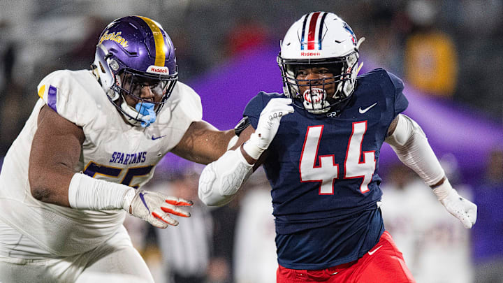 Pike Road's Khurtiss Perry (44) gets by Pleasant Grove's Anez Cooper in the AHSAA Class 5A State Football Championship Game at Protective Stadium in Birmingham, Ala., on Thursday December 2, 2021.

Pike26