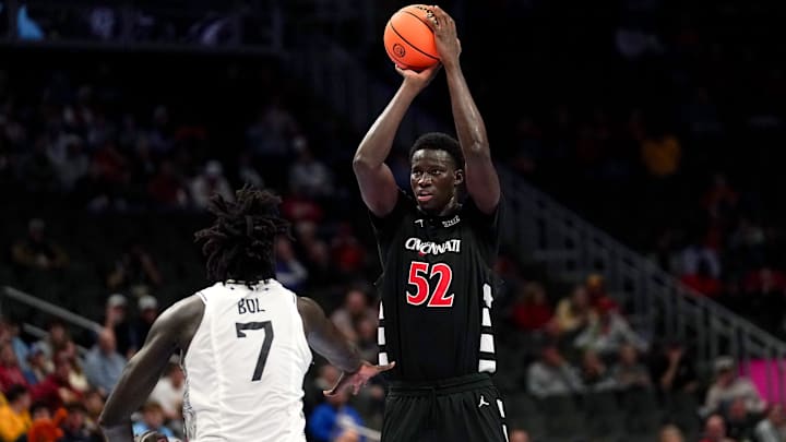 Cincinnati Bearcats center Moustapha Thiam (52) makes a basket from three point range in the first half of the second round of the Phillips 66 Big 12 Men’s Basketball Tournament between the Cincinnati Bearcats and UCF Knights, Wednesday, March 11, 2026, at T-Mobile Center in Kansas City, MO. Cincinnati Bearcats center Moustapha Thiam (52) makes a basket from three point range in the first half of the second round of the Phillips 66 Big 12 Men’s Basketball Tournament between the Cincinnati Bearcats and UCF Knights, Wednesday, March 11, 2026, at T-Mobile Center in Kansas City, MO.
