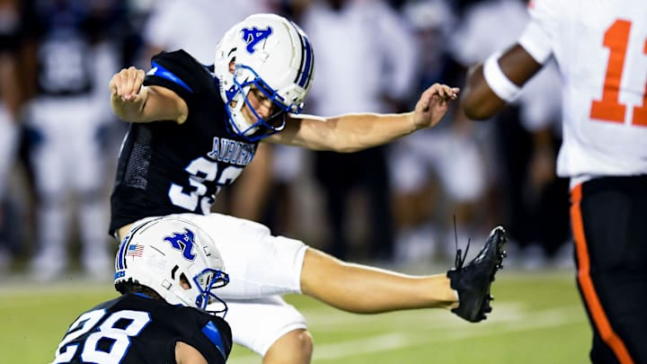 Auburn High School's Towns McGough (33) kicks the go ahead field goal against Hoover during their