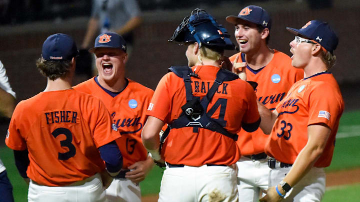 Auburn players celebrate winning their NCAA Regional Baseball Tournament at Plainsman Park in Auburn, Ala., on Sunday June 1, 2025.