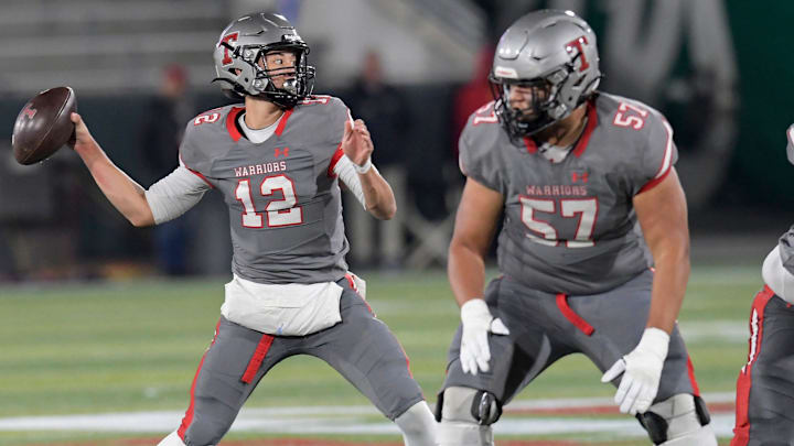 Thompson's Trent Seaborn (12) passes against Central Phenix City during the AHSAA 7A football state championship in Birmingham, Ala., on Wednesday December 3, 2024.