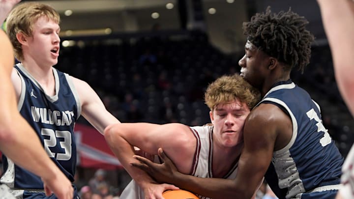 Enterprise's Tucker Wadsworth (23) and Malachi Reed (3) defend against Huntsville's Simon Walker (1) during their AHSAA Class 7A semi-final game at Legacy Arena in Birmingham, Ala., on Thursday, April 29, 2024.