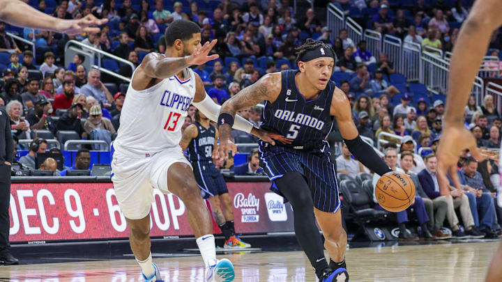 Dec 7, 2022; Orlando, Florida, USA; Orlando Magic forward Paolo Banchero (5) drives around LA