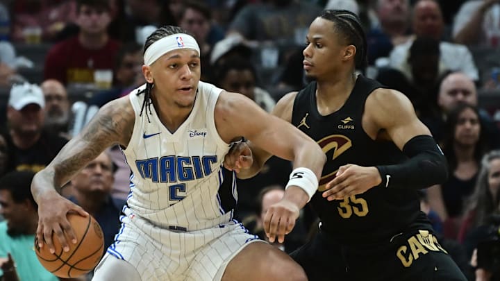 Apr 30, 2024; Cleveland, Ohio, USA; Cleveland Cavaliers forward Isaac Okoro (35) defends Orlando