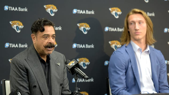 Jacksonville Jaguars owner Shad Khan takes questions from the media as his new first-round draft pick Trevor Lawrence looks on at a press conference on Friday, April 30, 2021, at TIAA Bank Field.