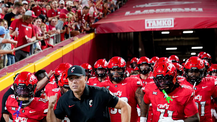 The Cincinnati Bearcats run out the tunnel to face off against the Nebraska Cornhuskers at the Kansas City Classic, Aug. 28, 2025, at Arrowhead Stadium in Kansas City, Mo.