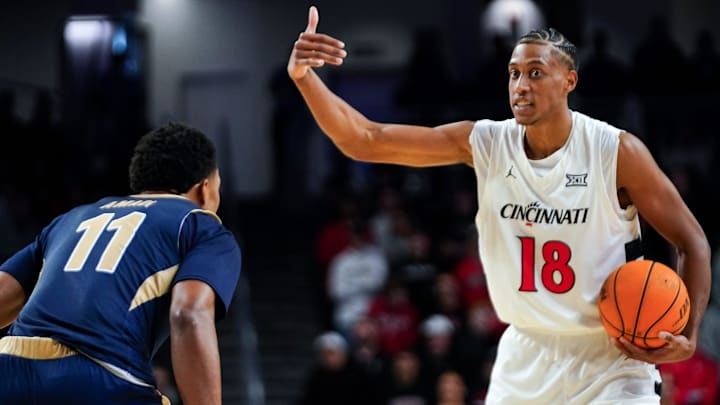 Cincinnati Bearcats forward Baba Miller (18) signals to a teammate in the first half of a NCAA men’s basketball game between the Cincinnati Bearcats and Mount St. Mary’s Mountaineers, Sunday, Nov. 16, 2025, at Fifth Third Arena in Cincinnati. Cincinnati Bearcats forward Baba Miller (18) signals to a teammate in the first half of a NCAA men’s basketball game between the Cincinnati Bearcats and Mount St. Mary’s Mountaineers, Sunday, Nov. 16, 2025, at Fifth Third Arena in Cincinnati.