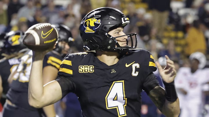 Sep 19, 2024; Boone, North Carolina, USA; Appalachian State Mountaineers quarterback Joey Aguilar (4) throws a pass against the South Alabama Jaguars during the second quarter at Kidd Brewer Stadium. Mandatory Credit: Reinhold Matay-Imagn Images Sep 19, 2024; Boone, North Carolina, USA; Appalachian State Mountaineers quarterback Joey Aguilar (4) throws a pass against the South Alabama Jaguars during the second quarter at Kidd Brewer Stadium. Mandatory Credit: Reinhold Matay-Imagn Images