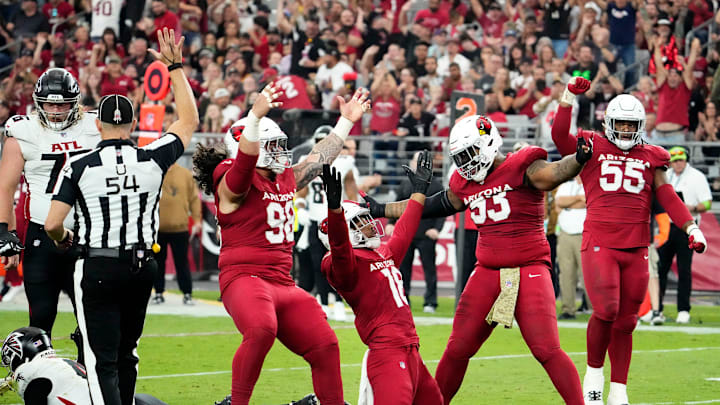 Arizona Cardinals linebacker BJ Ojulari (18) reacts after sacking Atlanta Falcons quarterback Taylor Heinicke (4) in the second half at State Farm Stadium in Glendale on Nov. 12, 2023.