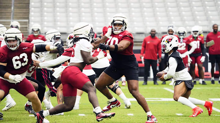 Arizona Cardinals offensive linemen Paris Johnson Jr. (70) during training camp at State Farm Stadium in Glendale on July 25, 2025. Arizona Cardinals offensive linemen Paris Johnson Jr. (70) during training camp at State Farm Stadium in Glendale on July 25, 2025.