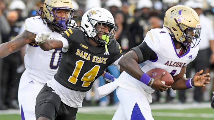 Alabama State defense back Adrian Maddox wraps up Alcorn quarterback Aaron Allen (4) during their game at Hornet Stadium in Montgomery, Ala., on Saturday September 30, 2023.