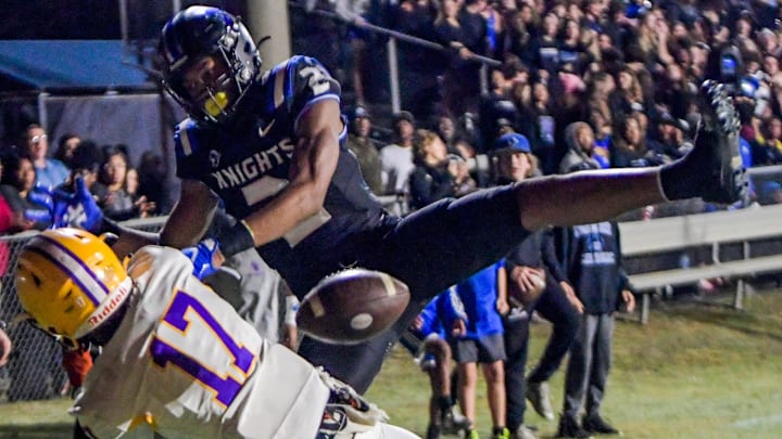 Booker T. Washington's Dylan Purter (17) defends again st Catholic's Jotavion Pierce (2) on an incomplete pass during AHSAA Semi-Final Playoff action on the Catholic campus in Montgomery, Ala., on Friday December 1, 2023.