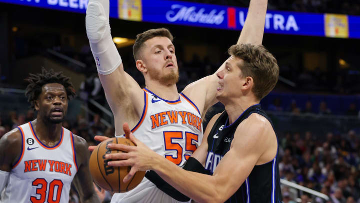 Feb 7, 2023; Orlando, Florida, USA; Orlando Magic center Moritz Wagner (right) is fouled by New York Knicks center Isaiah Hartenstein (55) during the second half at Amway Center. Mandatory Credit: Mike Watters-USA TODAY Sports