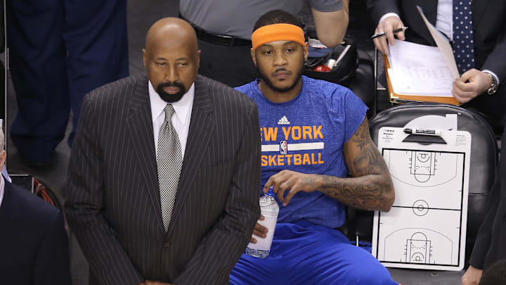 Apr 11, 2014; Toronto, Ontario, CAN; New York Knicks head coach Mike Woodson looks on as forward Carmelo Anthony (7) sits on the bench before the start of their game against the Toronto Raptors at Air Canada Centre. The Knicks beat the Raptors 108-100. Mandatory Credit: Tom Szczerbowski-Imagn Images Apr 11, 2014; Toronto, Ontario, CAN; New York Knicks head coach Mike Woodson looks on as forward Carmelo Anthony (7) sits on the bench before the start of their game against the Toronto Raptors at Air Canada Centre. The Knicks beat the Raptors 108-100. Mandatory Credit: Tom Szczerbowski-Imagn Images
