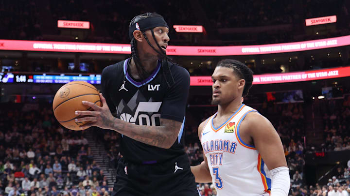 Utah Jazz guard Jordan Clarkson holds the ball away from Oklahoma City Thunder forward Dillon Jones. Mandatory Credit: Rob Gray-Imagn Images Utah Jazz guard Jordan Clarkson holds the ball away from Oklahoma City Thunder forward Dillon Jones. Mandatory Credit: Rob Gray-Imagn Images