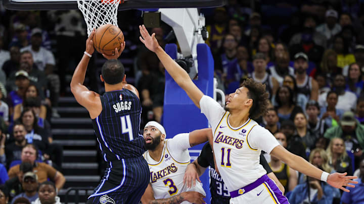 Nov 4, 2023; Orlando, Florida, USA; Orlando Magic guard Jalen Suggs (4) shoots the ball against Los Angeles Lakers forward Anthony Davis (3) and center Jaxson Hayes (11) during the first quarter at Amway Center. Mandatory Credit: Mike Watters-Imagn Images Nov 4, 2023; Orlando, Florida, USA; Orlando Magic guard Jalen Suggs (4) shoots the ball against Los Angeles Lakers forward Anthony Davis (3) and center Jaxson Hayes (11) during the first quarter at Amway Center. Mandatory Credit: Mike Watters-Imagn Images