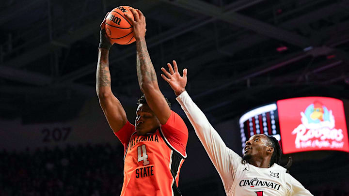 Oklahoma State Cowboys guard Christian Coleman (4) rebounds the ball in the first half of a NCAA men’s basketball game between the Cincinnati Bearcats and Oklahoma State Cowboys, Saturday, Feb. 28, 2026, at Fifth Third Arena in Cincinnati. Oklahoma State Cowboys guard Christian Coleman (4) rebounds the ball in the first half of a NCAA men’s basketball game between the Cincinnati Bearcats and Oklahoma State Cowboys, Saturday, Feb. 28, 2026, at Fifth Third Arena in Cincinnati.