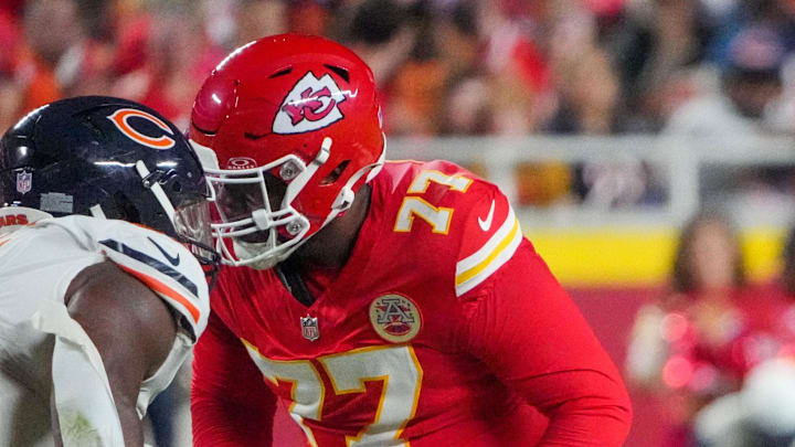 Aug 22, 2025; Kansas City, Missouri, USA; Kansas City Chiefs guard Jaylon Moore (77) and guard C.J. Hanson (61) at the line of scrimmage against the Chicago Bears during the game at GEHA Field at Arrowhead Stadium. Mandatory Credit: Denny Medley-Imagn Images