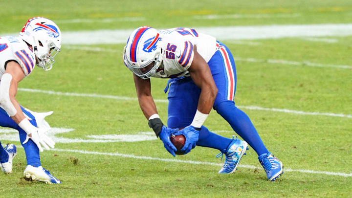 Dec 19, 2020; Denver, Colorado, USA; Buffalo Bills defensive end Jerry Hughes (55) recovers a fumble and runs for a touchdown against the Denver Broncos during the third quarter at Empower Field at Mile High