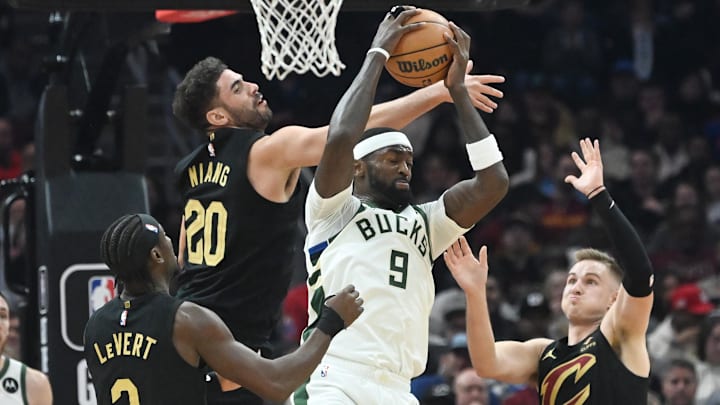 Jan 17, 2024; Cleveland, Ohio, USA; Milwaukee Bucks forward Bobby Portis (9) and Cleveland Cavaliers forward Georges Niang (20) and guard Caris LeVert (3) and guard Sam Merrill (5) go for a rebound during the first half at Rocket Mortgage FieldHouse. Mandatory Credit: Ken Blaze-Imagn Images