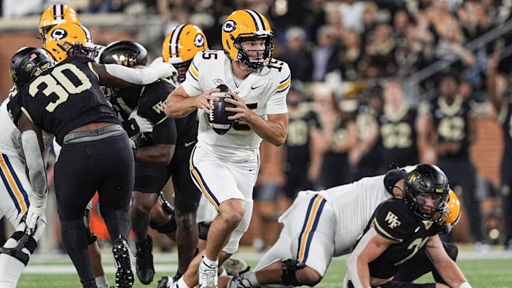 Fernando Mendoza on the run. Fernando Mendoza on the run.