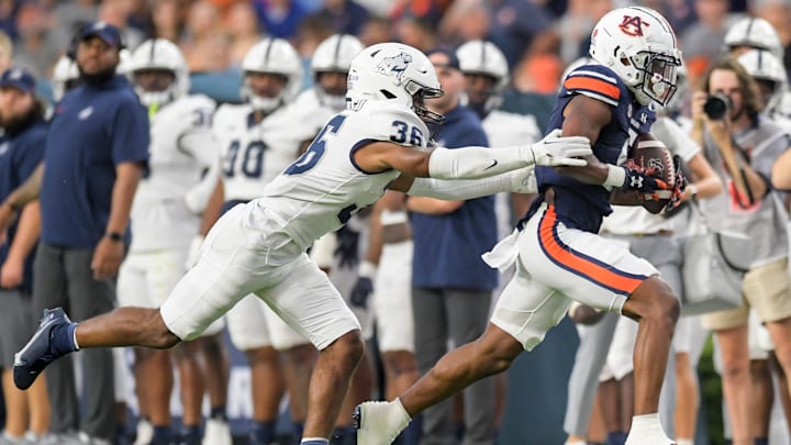 Auburn Tigers wide receiver Jay Fair (5) is stopped afewter a big gain by Samford Bulldogs defensive back Dontae Pollard (36) during first half action in the AU vs. Samford game at Jordan-Hare Stadium in the AU campus in Auburn, Ala., on Saturday September 16, 2023.