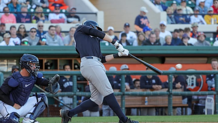 New York Yankees first baseman Ben Rice (93) hits a double during the third inning against the Detroit Tigers at Publix Field at Joker Marchant Stadium on March 21.