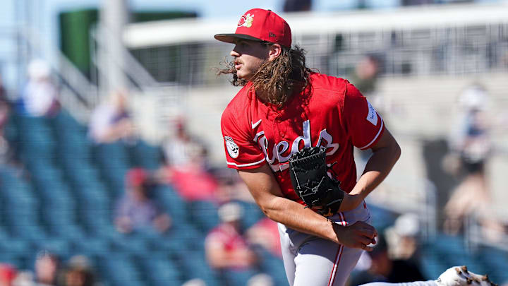 Cincinnati Reds pitcher Rhett Lowder (25) delivers a pitch in the third inning of a Cactus League game between the Cincinnati Reds and Cleveland Guardians, Saturday, Feb. 21, 2026, at Goodyear Ballpark in Goodyear, Ariz.
