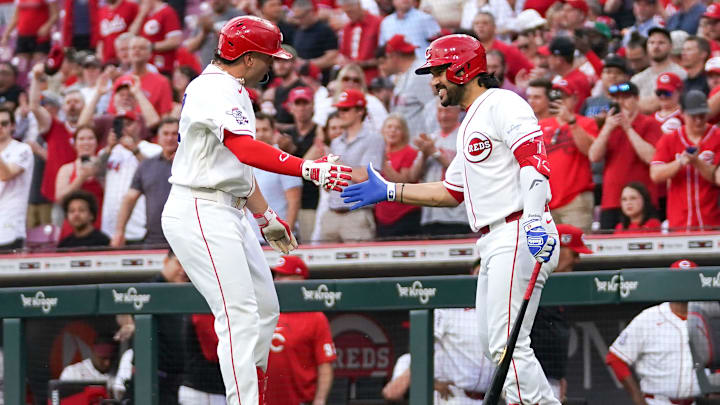 Cincinnati Reds designated hitter Eugenio Suárez (42) and Cincinnati Reds first baseman Sal Stewart (42) share a high five after Stewart scored his second three-run home run in the second inning of a MLB game between the Cincinnati Reds and San Francisco Giants, Wednesday, April 15, 2026, at Great American Ball Park in downtown Cincinnati.