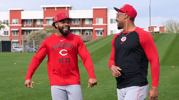 Cincinnati Reds outfielders Rece Hinds (57) and Will Benson (30) share a conversation during the first day of full squad workouts, Monday, Feb. 16, 2026, at the Cincinnati Reds player development complex in Goodyear, Ariz.