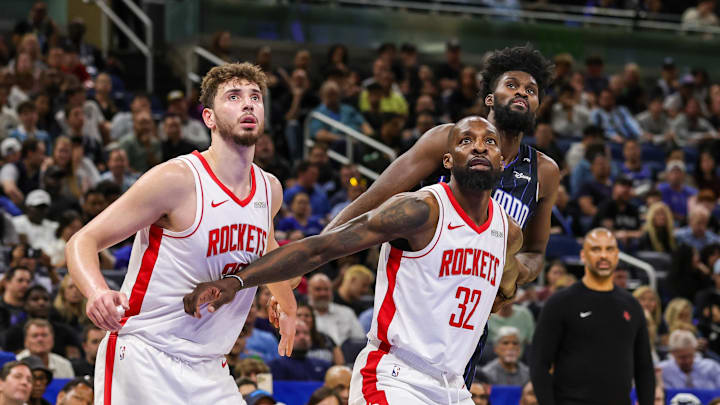Mar 19, 2025; Orlando, Florida, USA; Houston Rockets center Alperen Sengun (28), forward Jeff Green (32) and Orlando Magic forward Jonathan Isaac (1) look for the rebound during the second quarter at Kia Center. Mandatory Credit: Mike Watters-Imagn Images