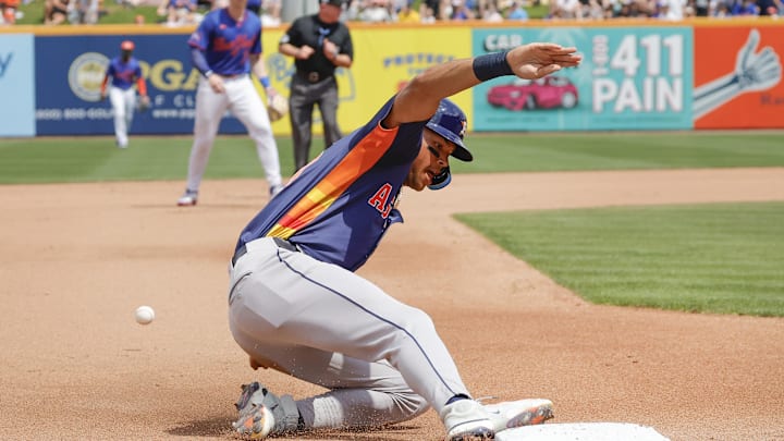 Houston Astros outfielder Cam Smith slides safely into third base during the fourth inning against the New York Mets at Clover Park on March 16. Houston Astros outfielder Cam Smith slides safely into third base during the fourth inning against the New York Mets at Clover Park on March 16.