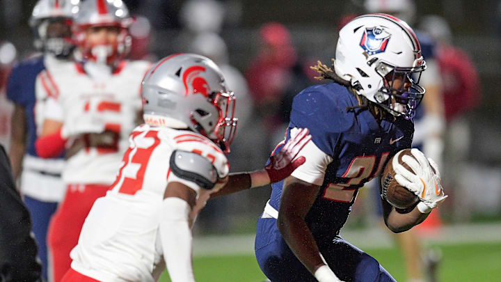 Pike Road's Ja'Michael Jones (21) scores a late touchdown against Saraland during their AHSAA football playoff game on the Pike Road High School campus in Pike Road, Ala., Friday evening November 29, 2024.