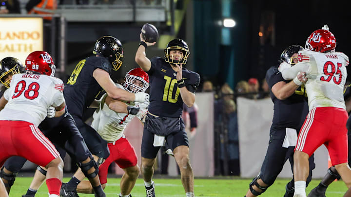 Nov 29, 2024; Orlando, Florida, USA; UCF Knights quarterback Dylan Rizk (10) passes during the second quarter against the Utah Utes at FBC Mortgage Stadium. Mandatory Credit: Mike Watters-Imagn Images